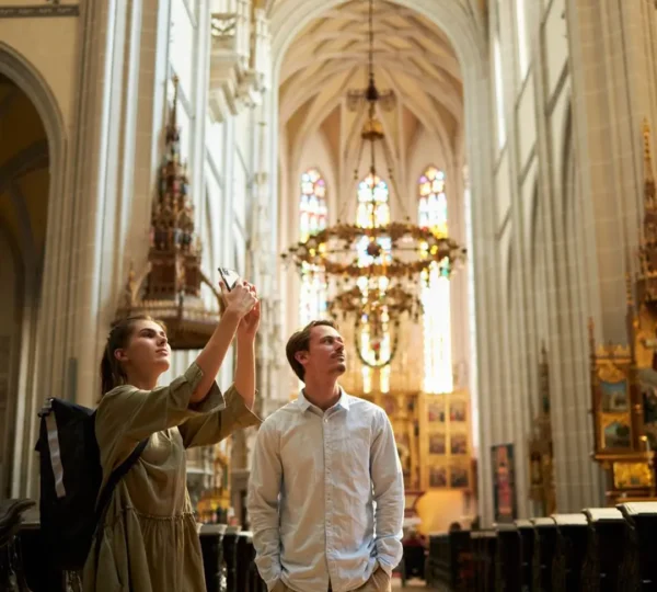 Two young people discovering Cathedral of St. Elizabeth in Košice